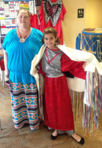 Sharon Hall (to the left) and Kayden Williams (to the right) shared the culture of the Native American with the Saint Leo community through stories and artifacts on Nov. 2. Hall is dressed in the traditional Native style, while Williams is dressed in the fancy style. 