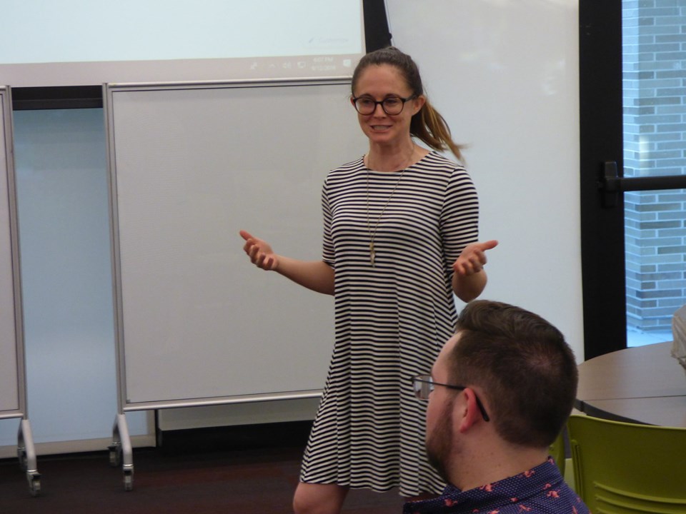 Tiffany Nelson presenting in a Kirk Hall