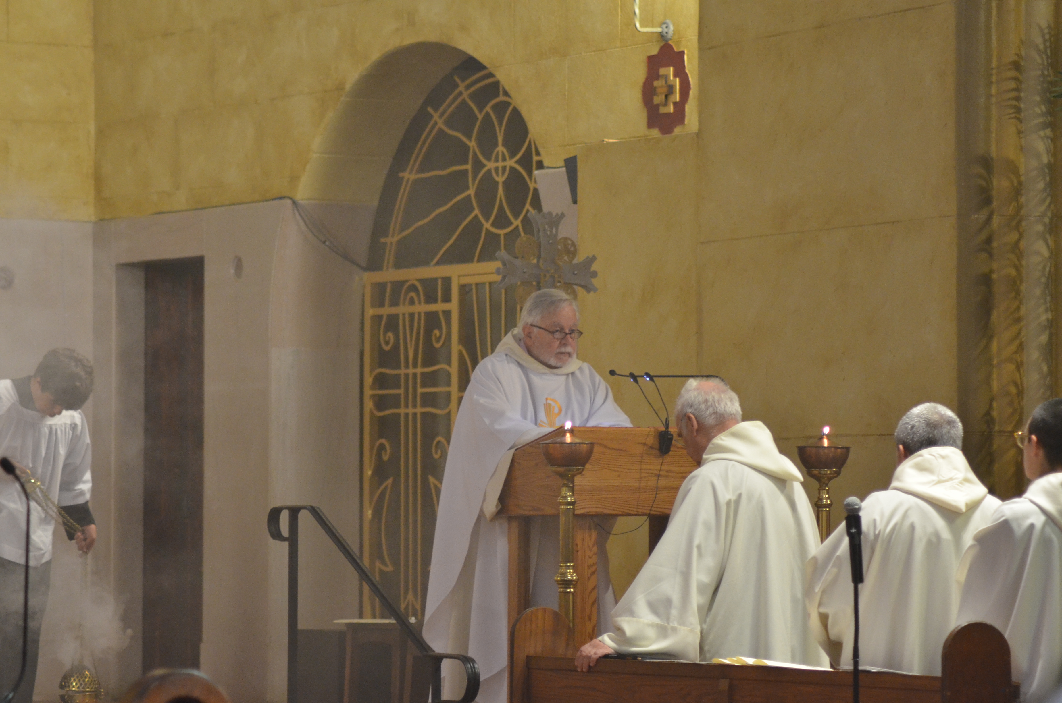 Abbot Isaac Camacho reading the Gospel.