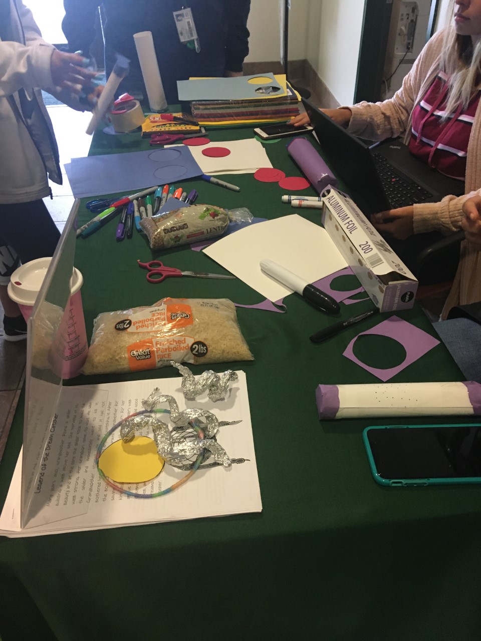 Saint Leo Students making rain sticks, top view close up shot