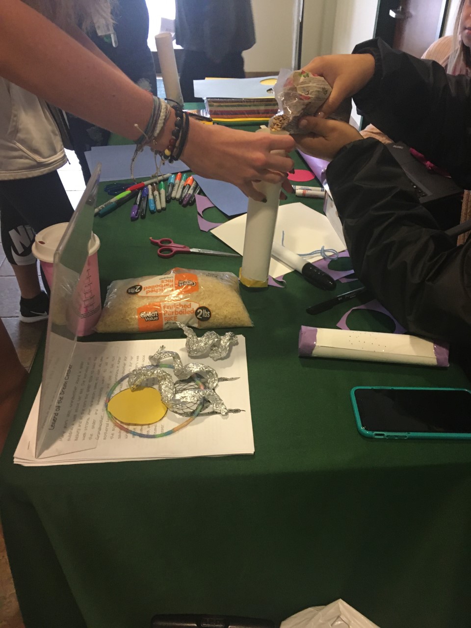 Saint Leo Students making rain sticks, close shot