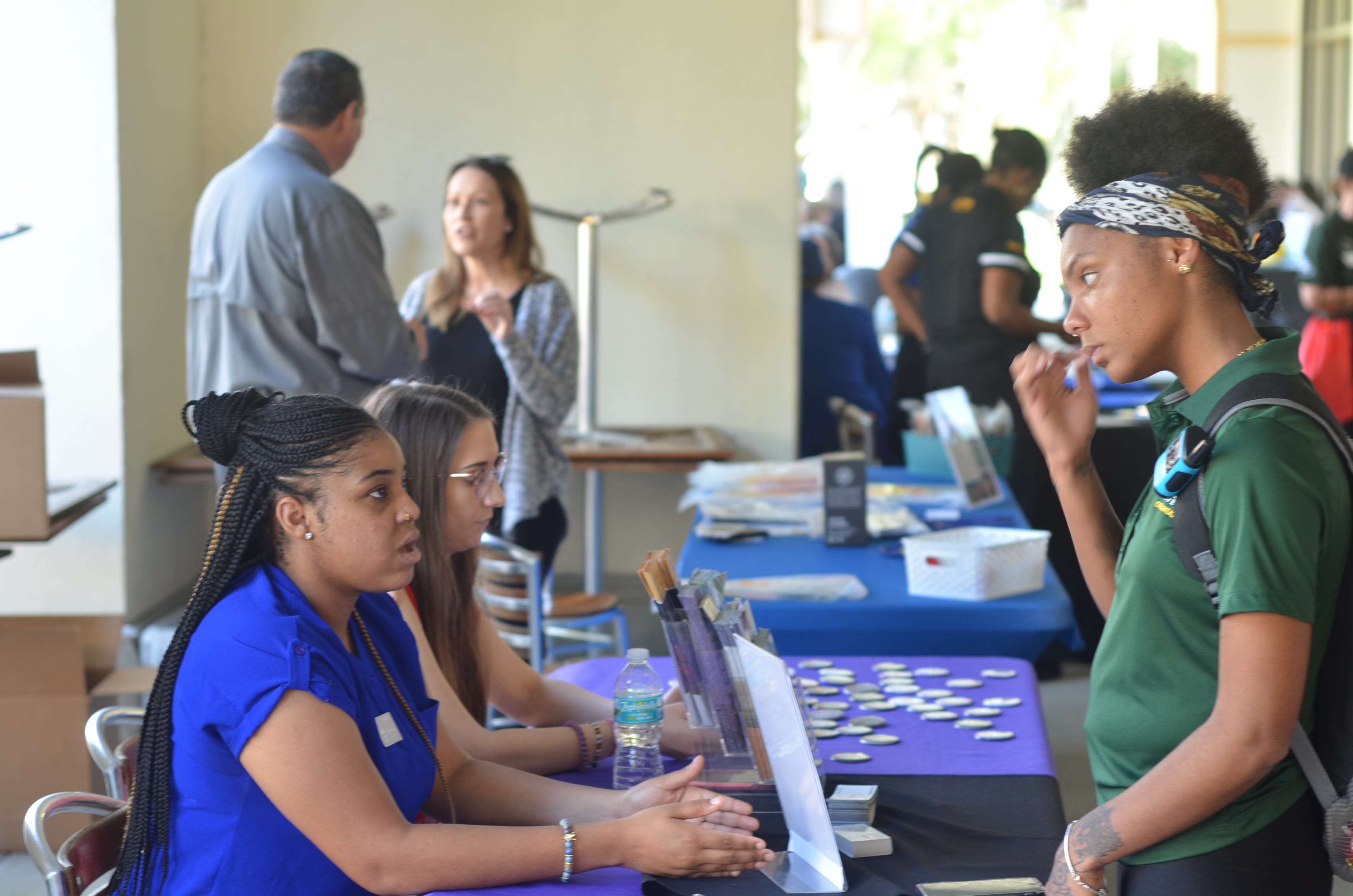 Students engaging with table.