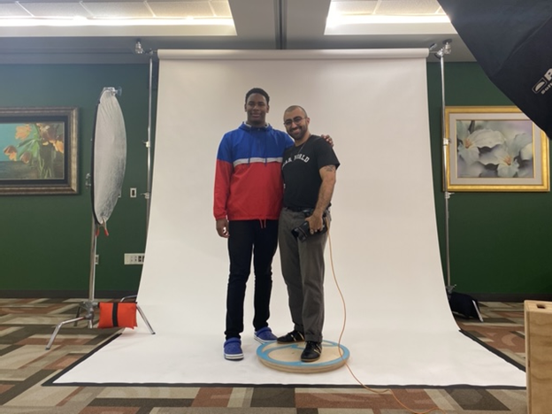 Student enjoys his story being told from Dear World, during a photo shoot.