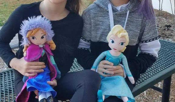 Cut Line: CC (left), Madelyn (center), and Maya (right) represented our arts and culture group and they let their creativity flourish in their movie review about the movie sequel six years in the making, Frozen 2.
