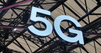 5G sign hanging from ceiling.