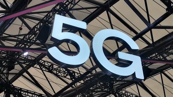 5G sign hanging from ceiling.