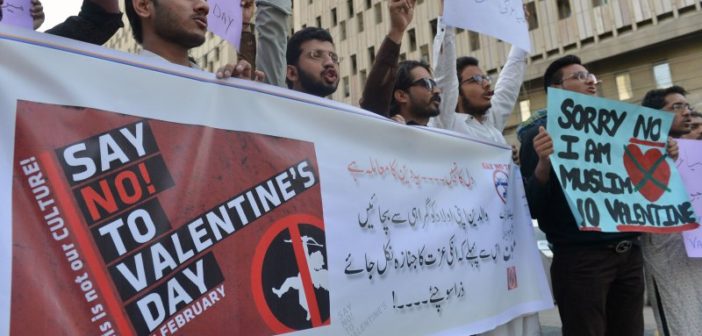 Protesting sign being held by people that reads "Say No To Valentine's Day".