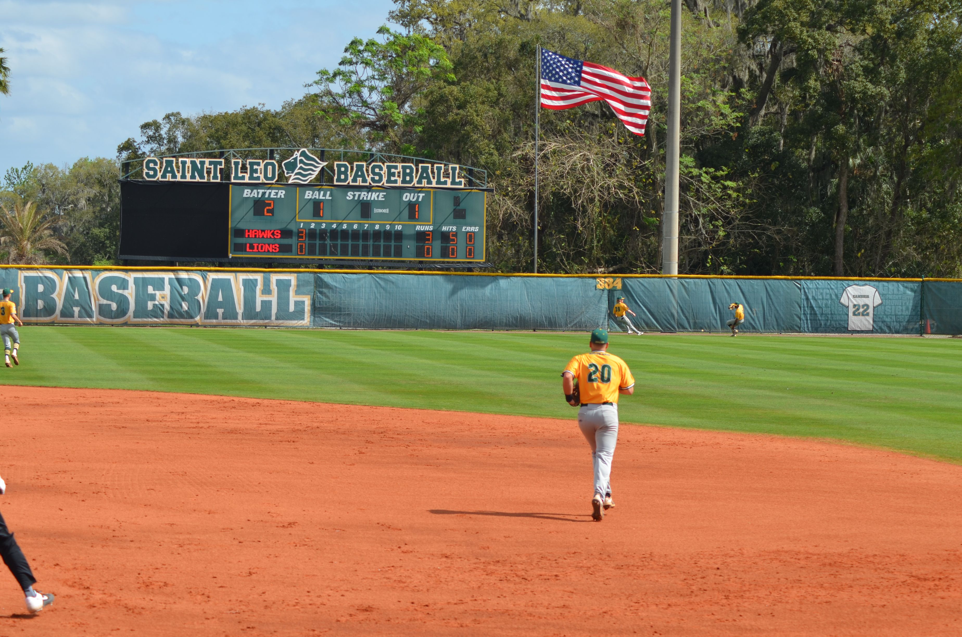 Mike Wyman runs to receive a throw from the outfield.