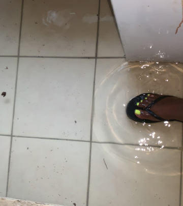 Feet in flooded floor.
