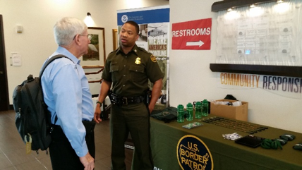 Jason White At Work At the U.S Border Patrol Booth Explaining the Job Position.