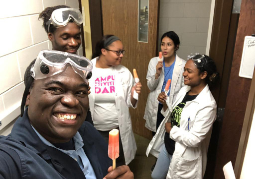 John Hall and friends wearing lab coats.