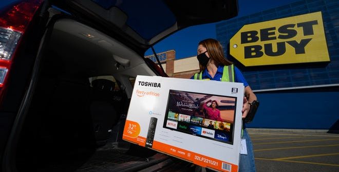 Shopper with tv outside Best Buy store