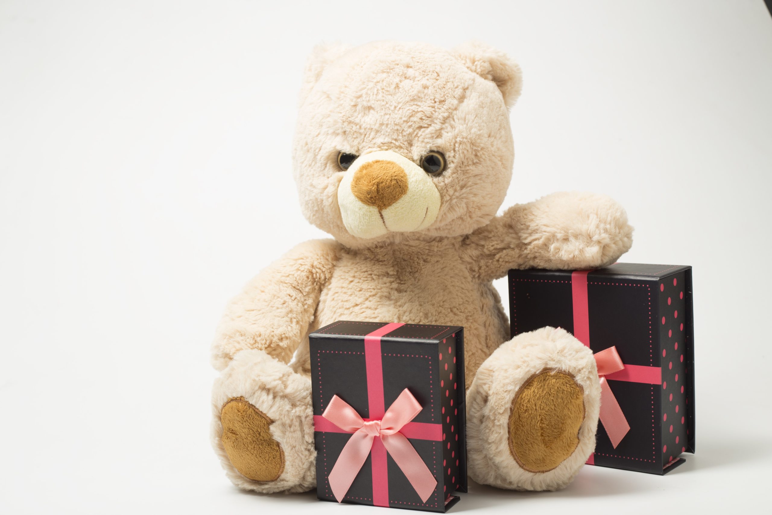 A stuffed bear and boxed gifts