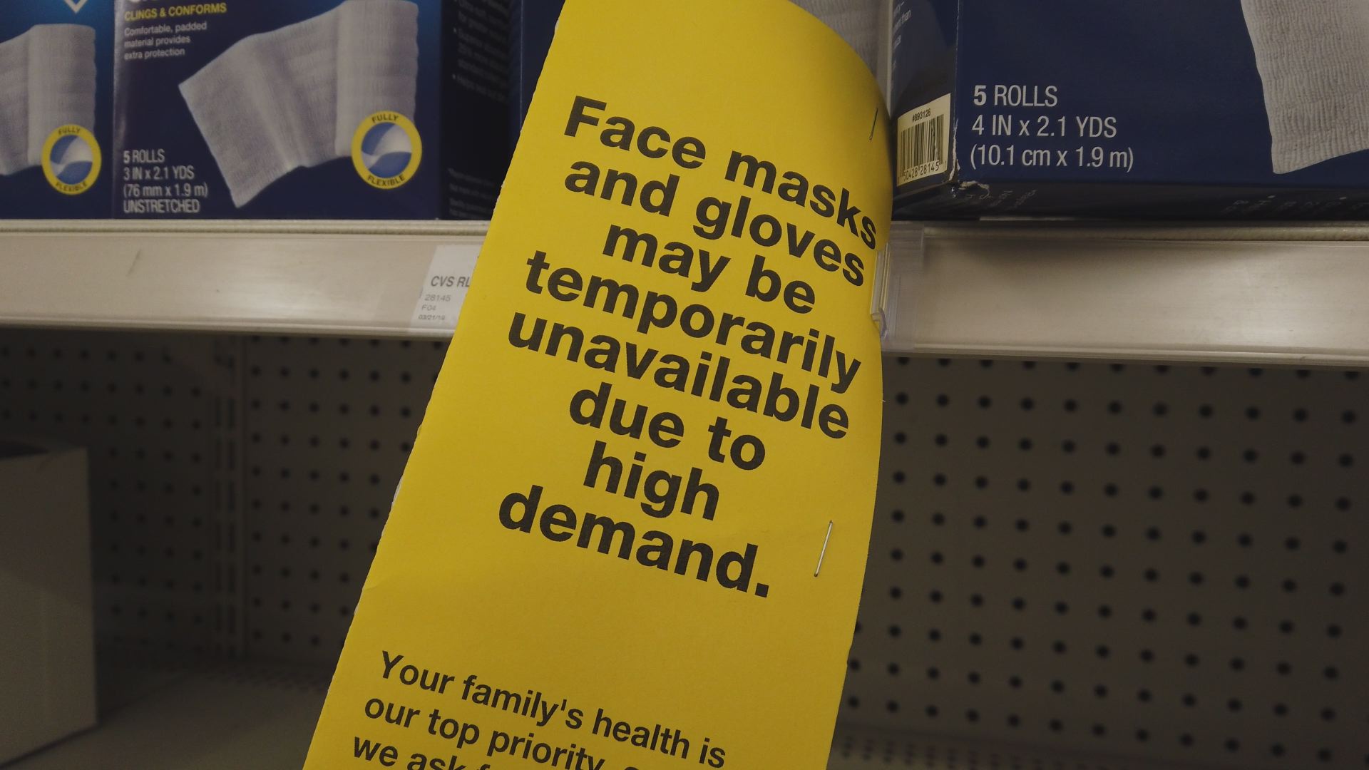 Sign saying "Face masks and gloves may be temporarily unavailable due to high demand.""
