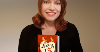 Amy Harris, Instruction & Assessment Librarian at the Cannon Memorial Library, holding the book "Lizzy & Jane" by Katherine Reay.