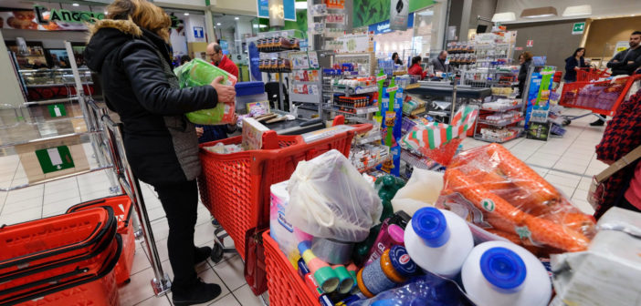 Crowded store with loaded shopping carts