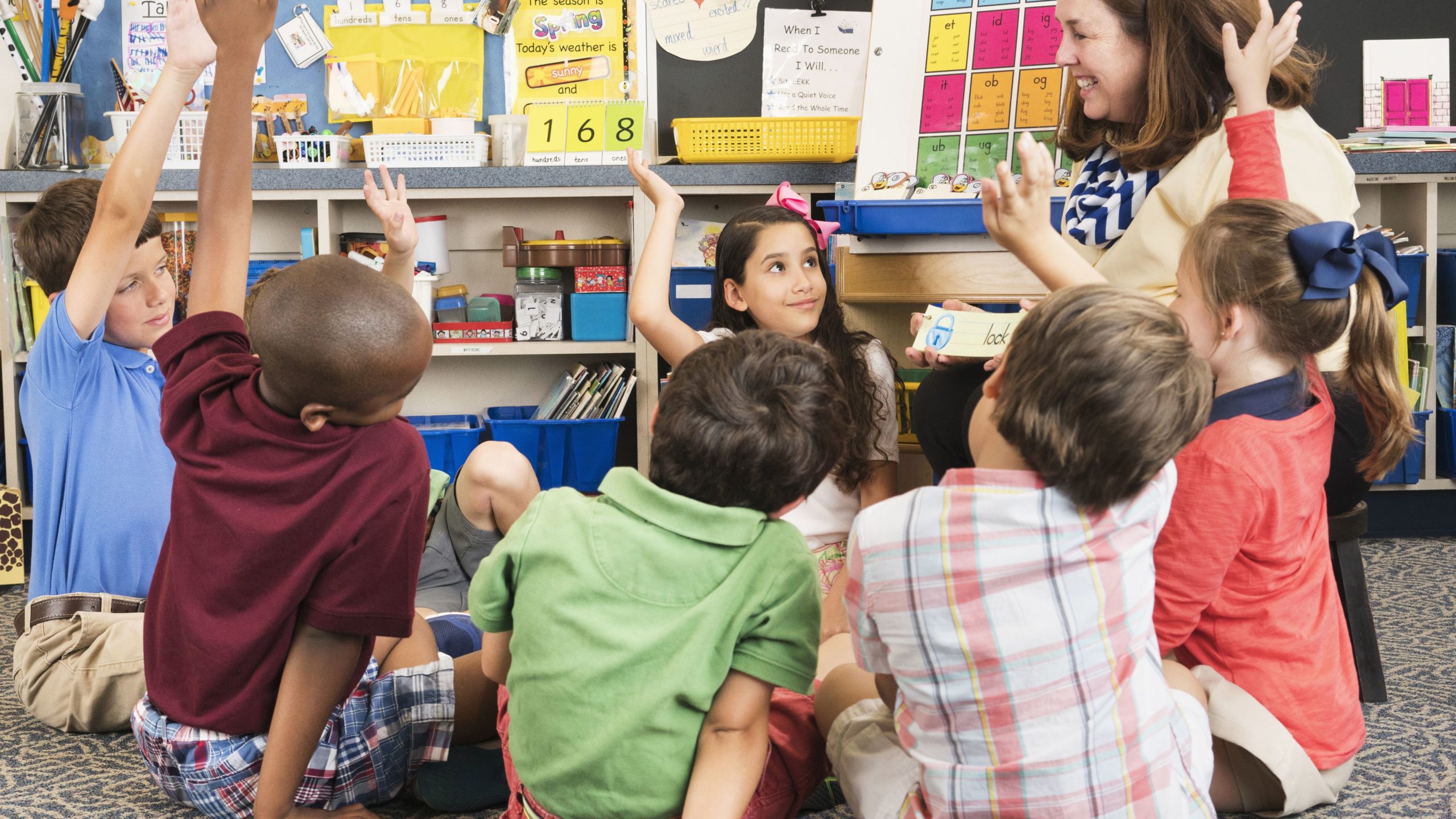 Students sitting in a circle with teacher