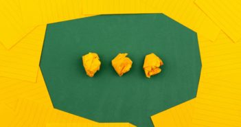 a green chat bubble on a yellow background